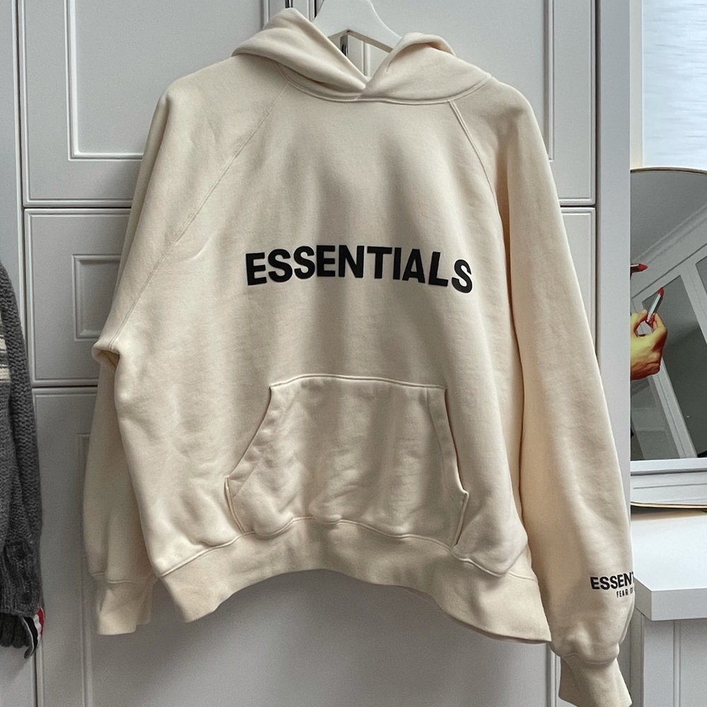 Fear of God Essentials Cream Hoodie with Black Logo